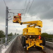 A mobile elevated working platform on track, working on the overhead lines.