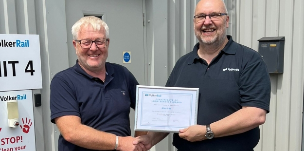 Man smiling receiving his award