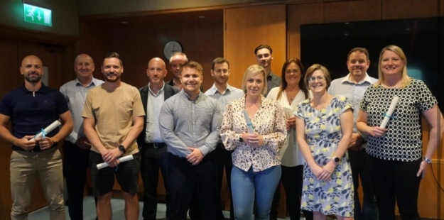 Group of people collecting their certificates