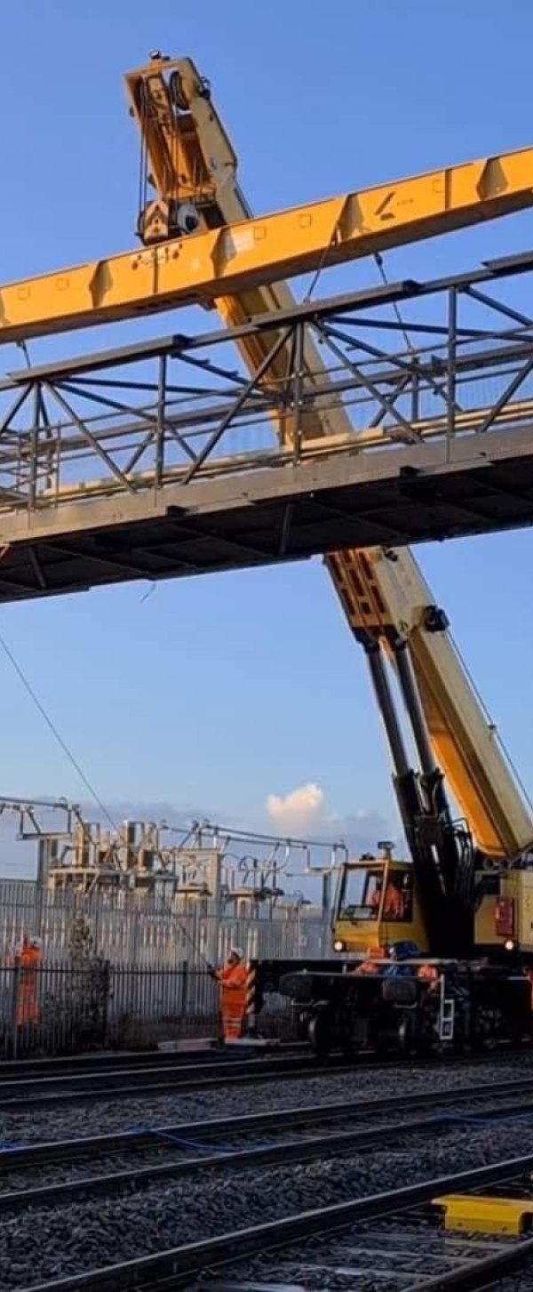 Kirow 1200 crane installing overhead line structure