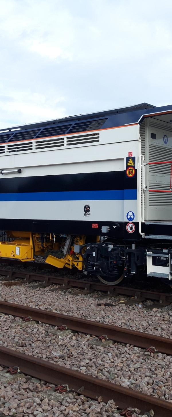 A Matisa tamper tamping on the railway tracks