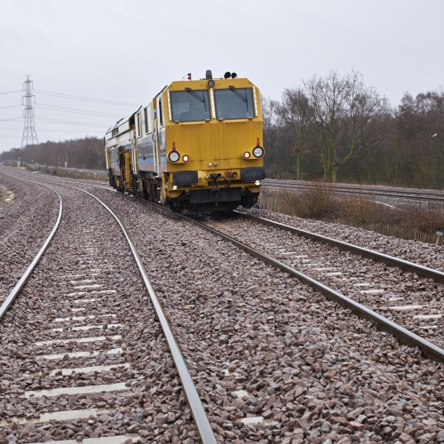A Matisa tamper tamping on the railway tracks