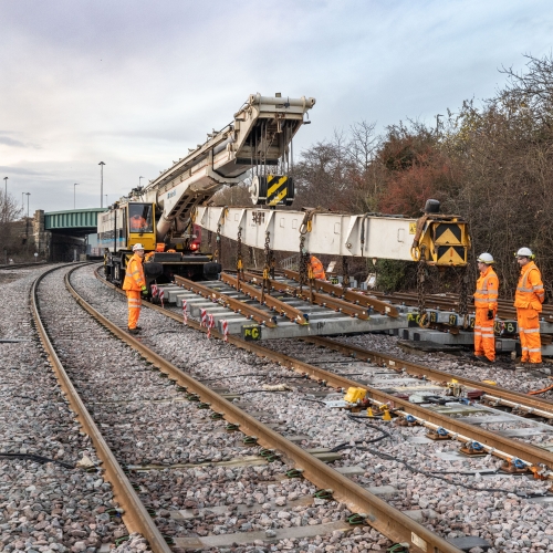 A Kirow crane installing track