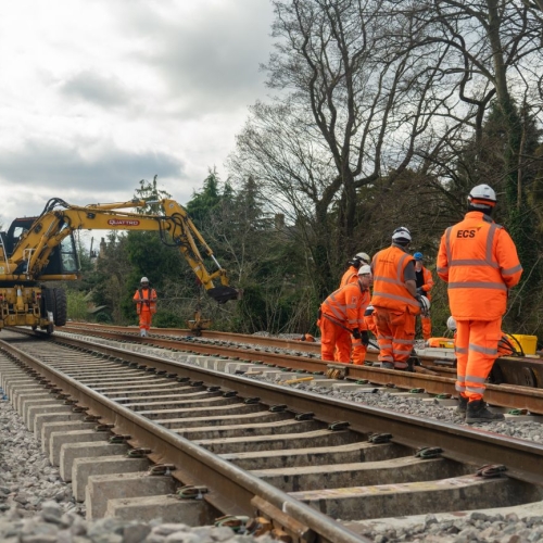 People in orange high vis working on the railway