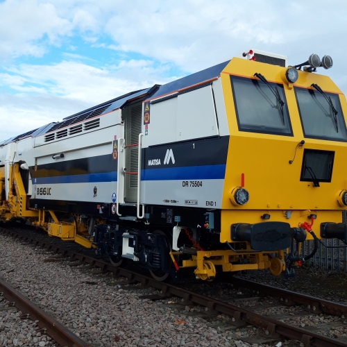 A Matisa tamper tamping on the railway tracks