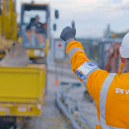 man putting his thumb up to a machine on site