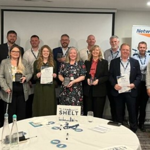 group of people with wards and certificates