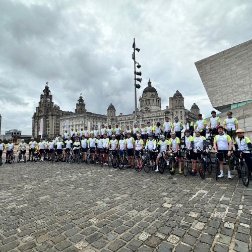 all cyclists in a line outside the Liverpool Museum