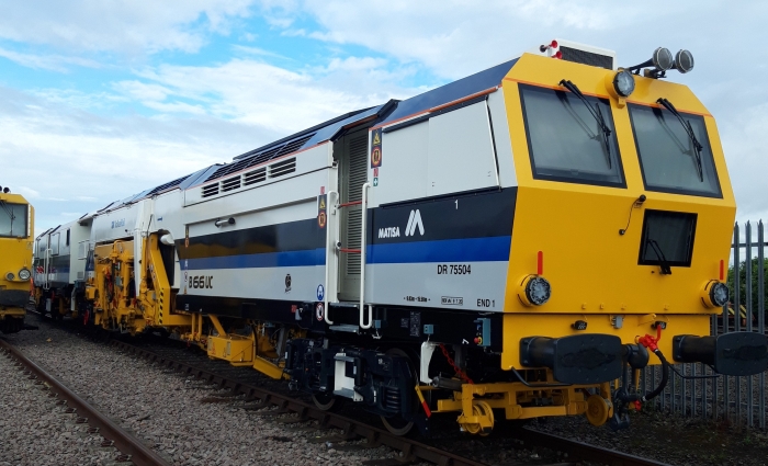 A Matisa tamper tamping on the railway tracks
