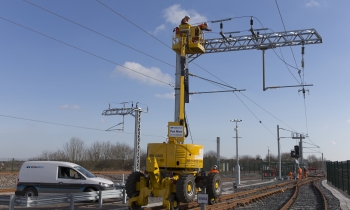 MEWP working an overhead line at a depot