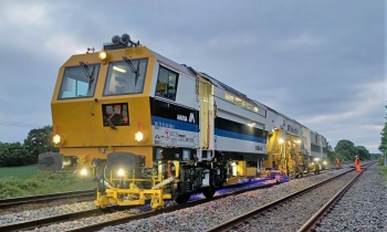 Matisa tamper tamping the railway tracks