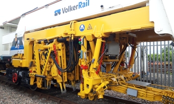 A Matisa tamper tamping on the railway tracks