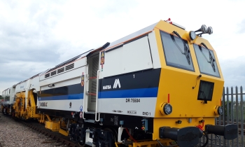 A Matisa tamper tamping on the railway tracks