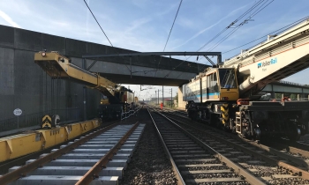 Two Kirow 1200 cranes working on the railway