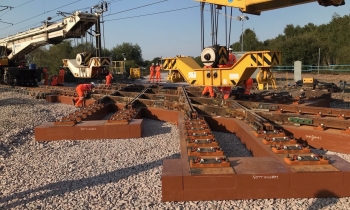 Two Kirow cranes installing a diamond crossing