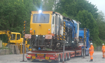 A Beaver tamper on the back of a lorry