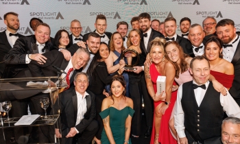 group of happy people on stage