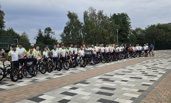 group of cyclists posing for a picture