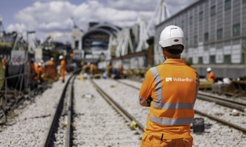 ground shot showing man in PPE with VolkerRail logo