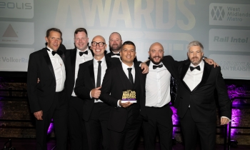 people holding the global light rail award