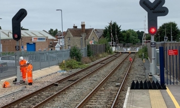 First section of East West Rail Phase Two railway commissioned - Standing Red Men pedestrian signals.jpg