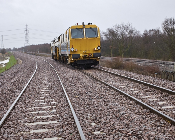 A Matisa tamper tamping on the railway tracks