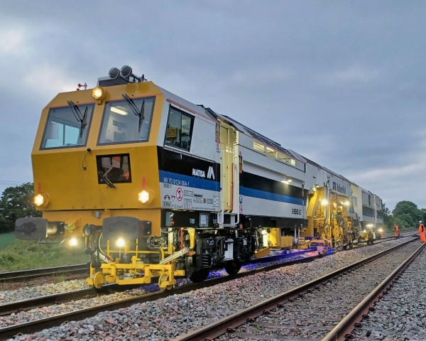 Matisa tamper tamping the railway tracks