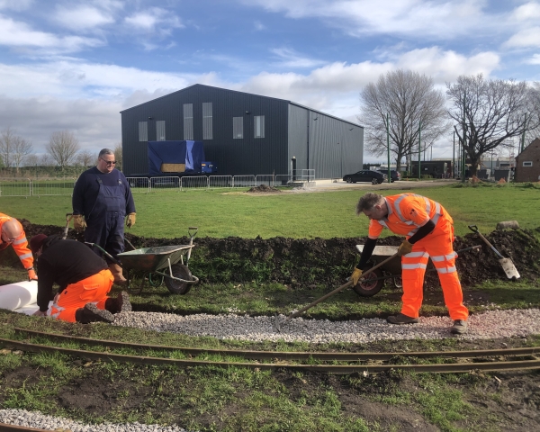 VolkerRail volunteers installing a narrow gauge railway