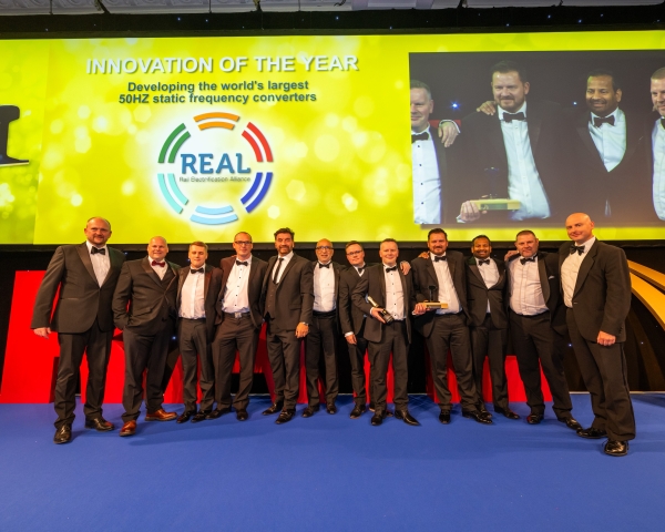 REAL Alliance collecting an award