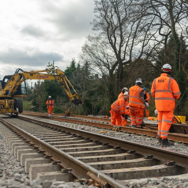 People in orange high vis working on the railway