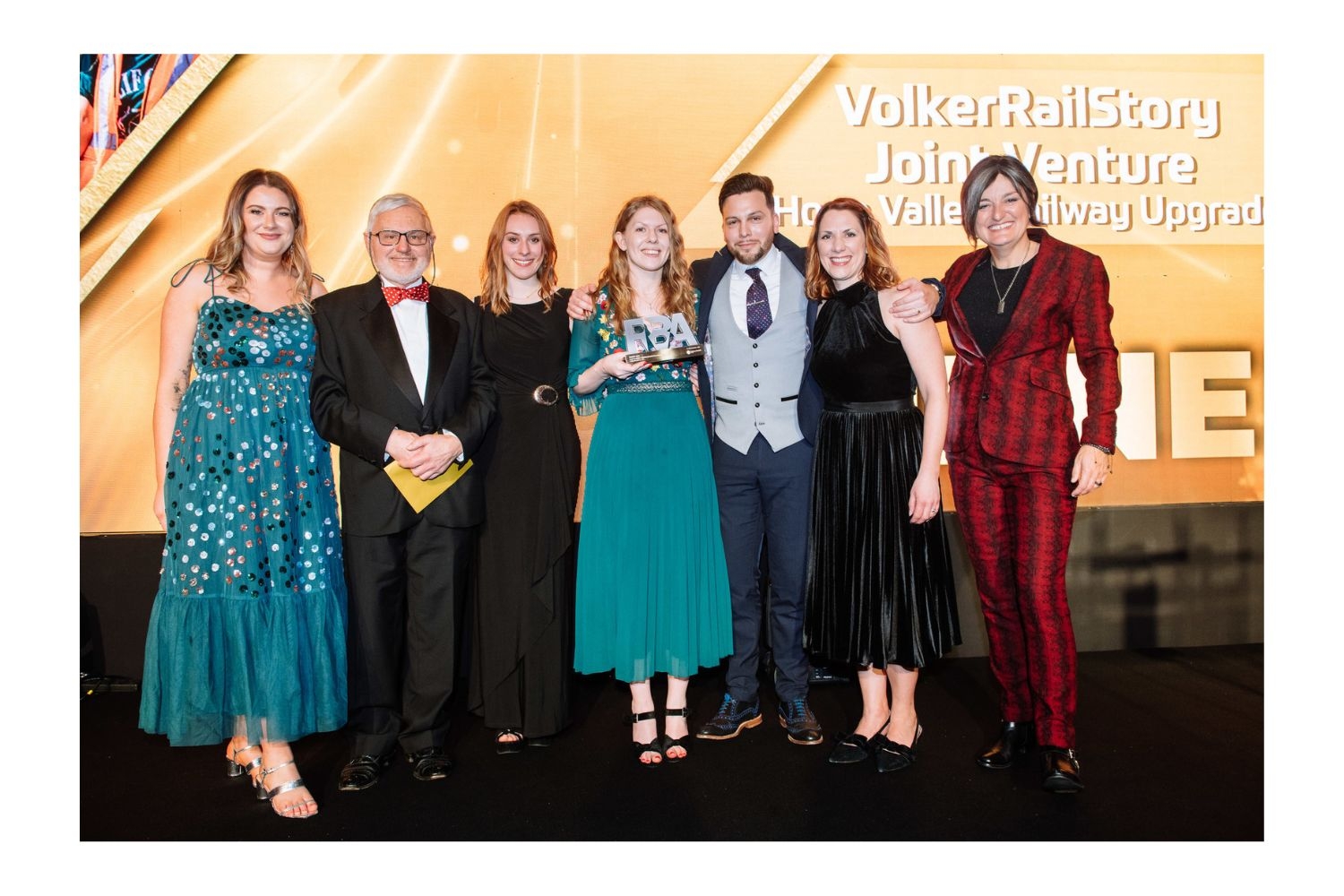 group of people collecting an award