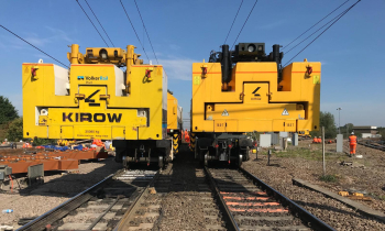 Two Kirow 1200 cranes working on the railway