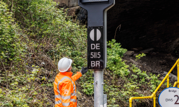 Signal at Hope Valley with man in PPE inspecting it