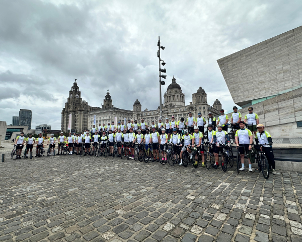 all cyclists in a line outside the Liverpool Museum