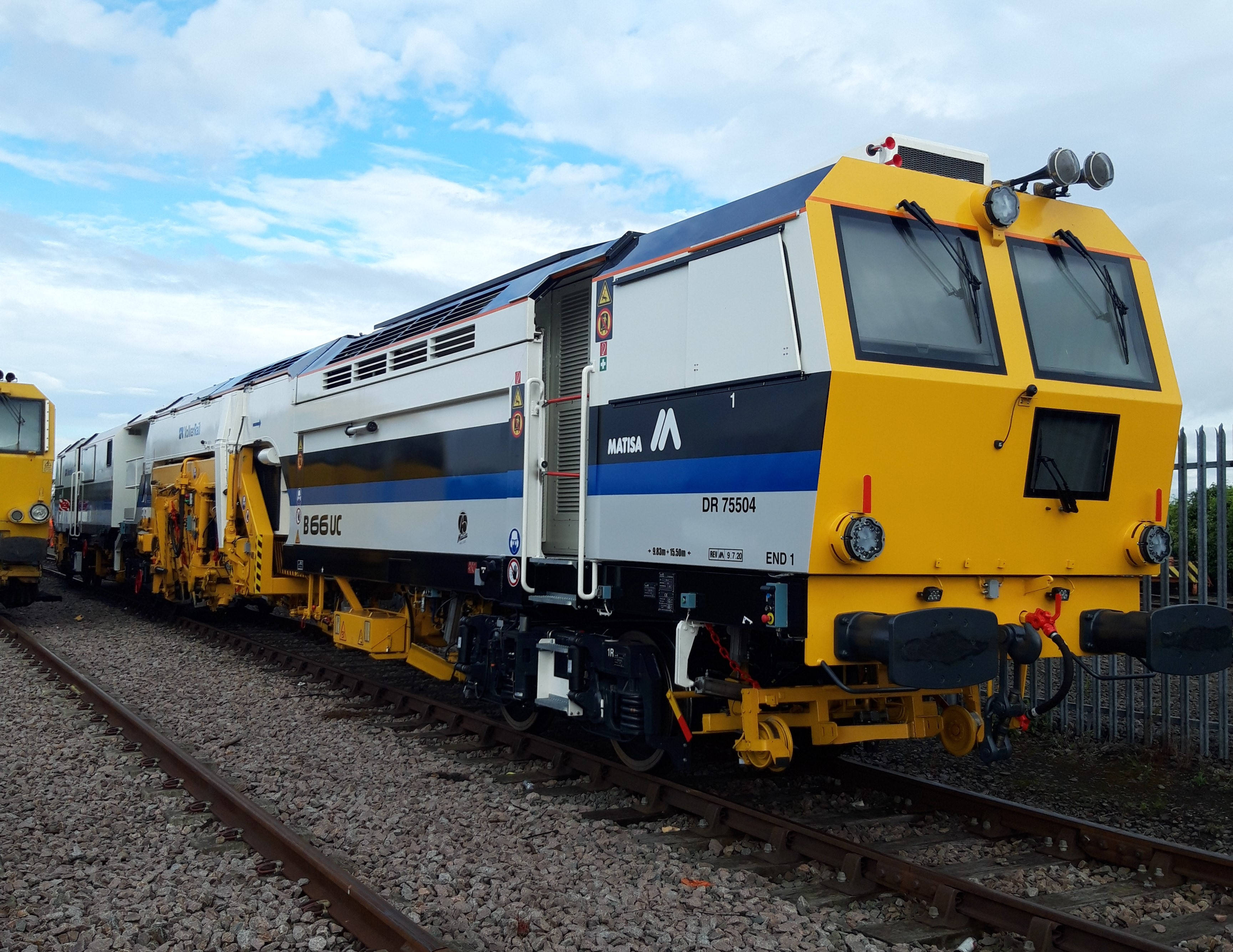 A Matisa tamper tamping on the railway tracks